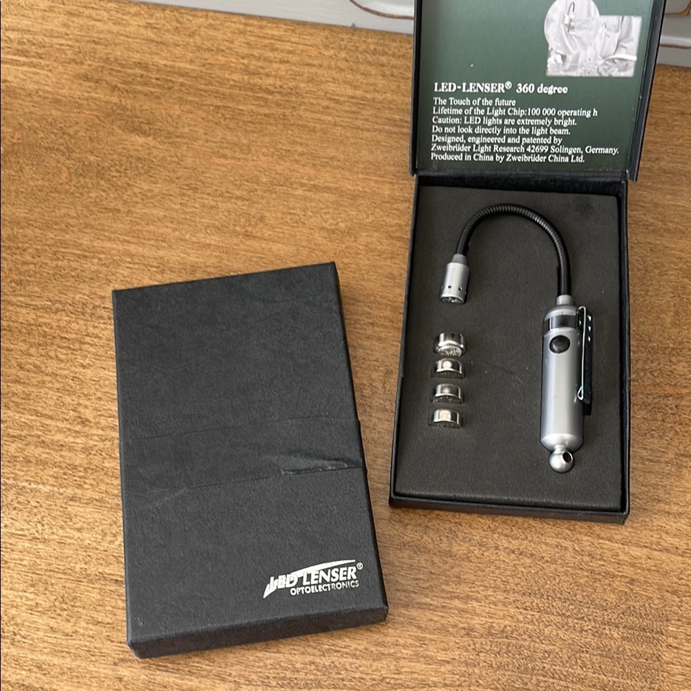 NWOT LED Lenser Silver Flashlight with Accessories